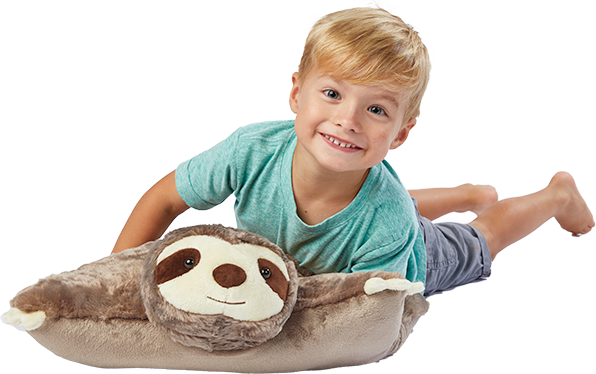 A young boy lying on the brown Sunny Sloth Pillow Pet